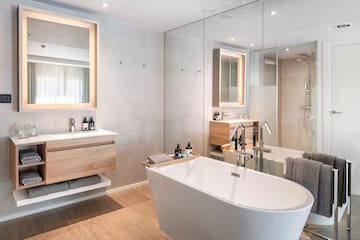 a bathroom with a tub and sink