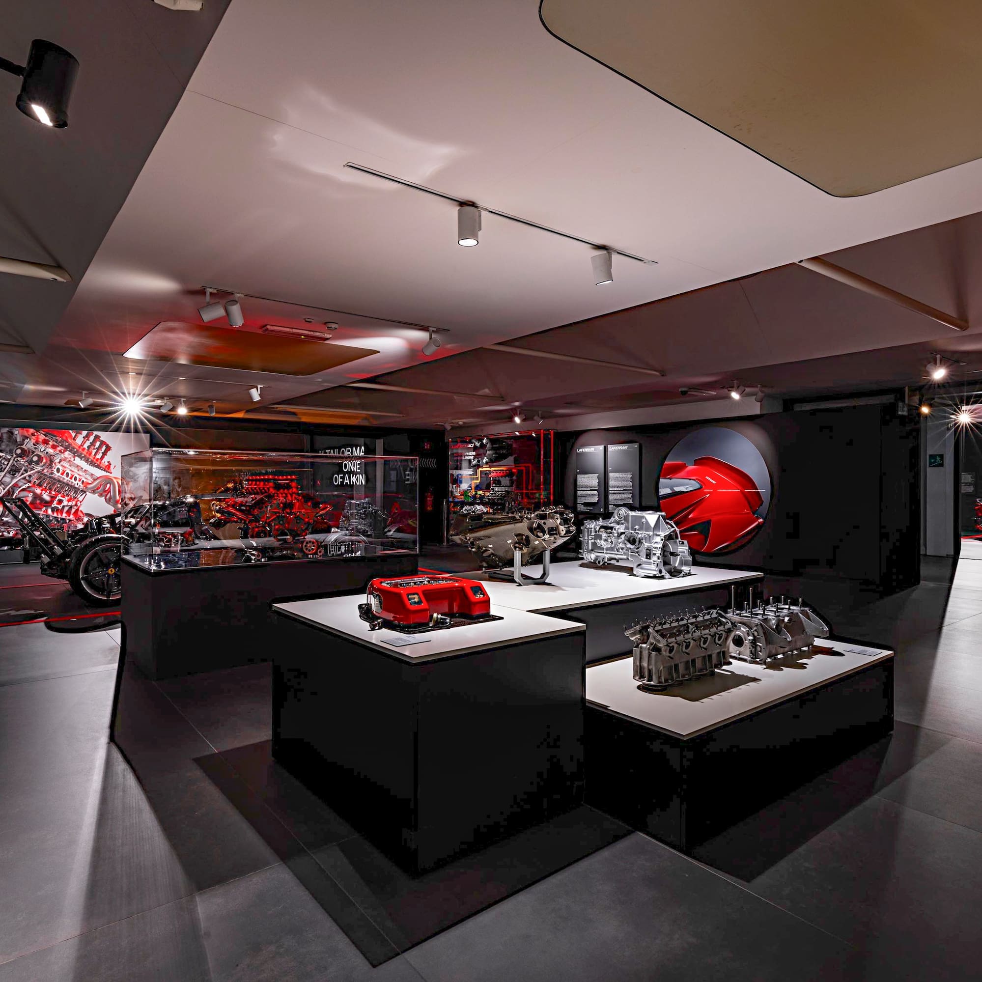 a room with a display of motorcycles