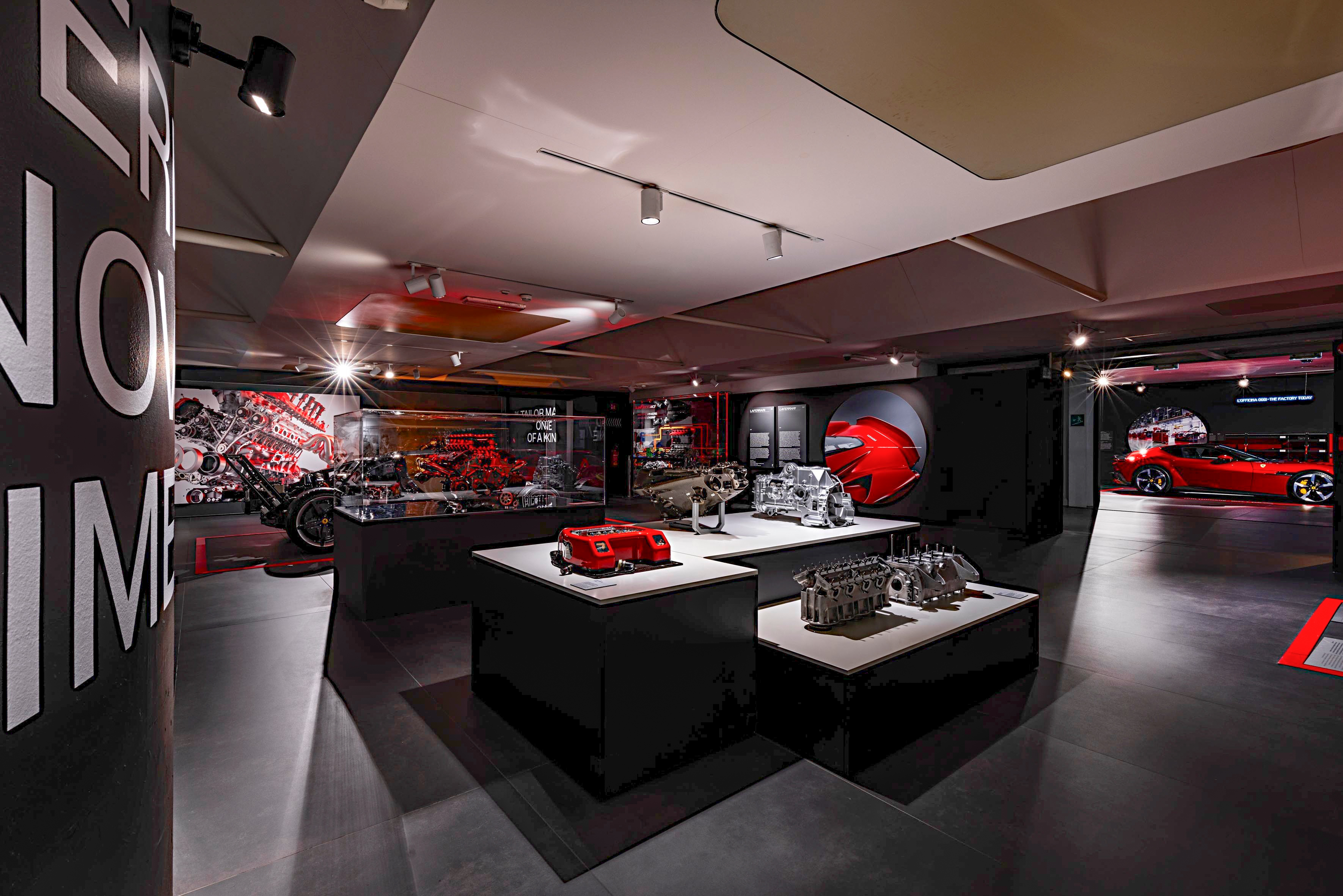 a room with a display of motorcycles