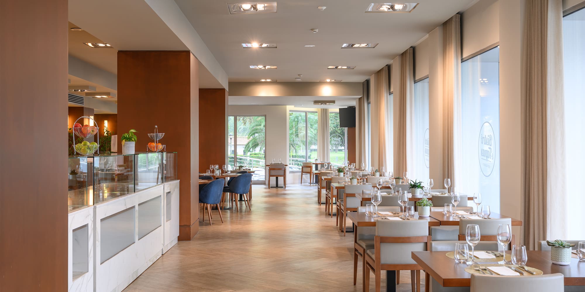 a restaurant with tables and chairs