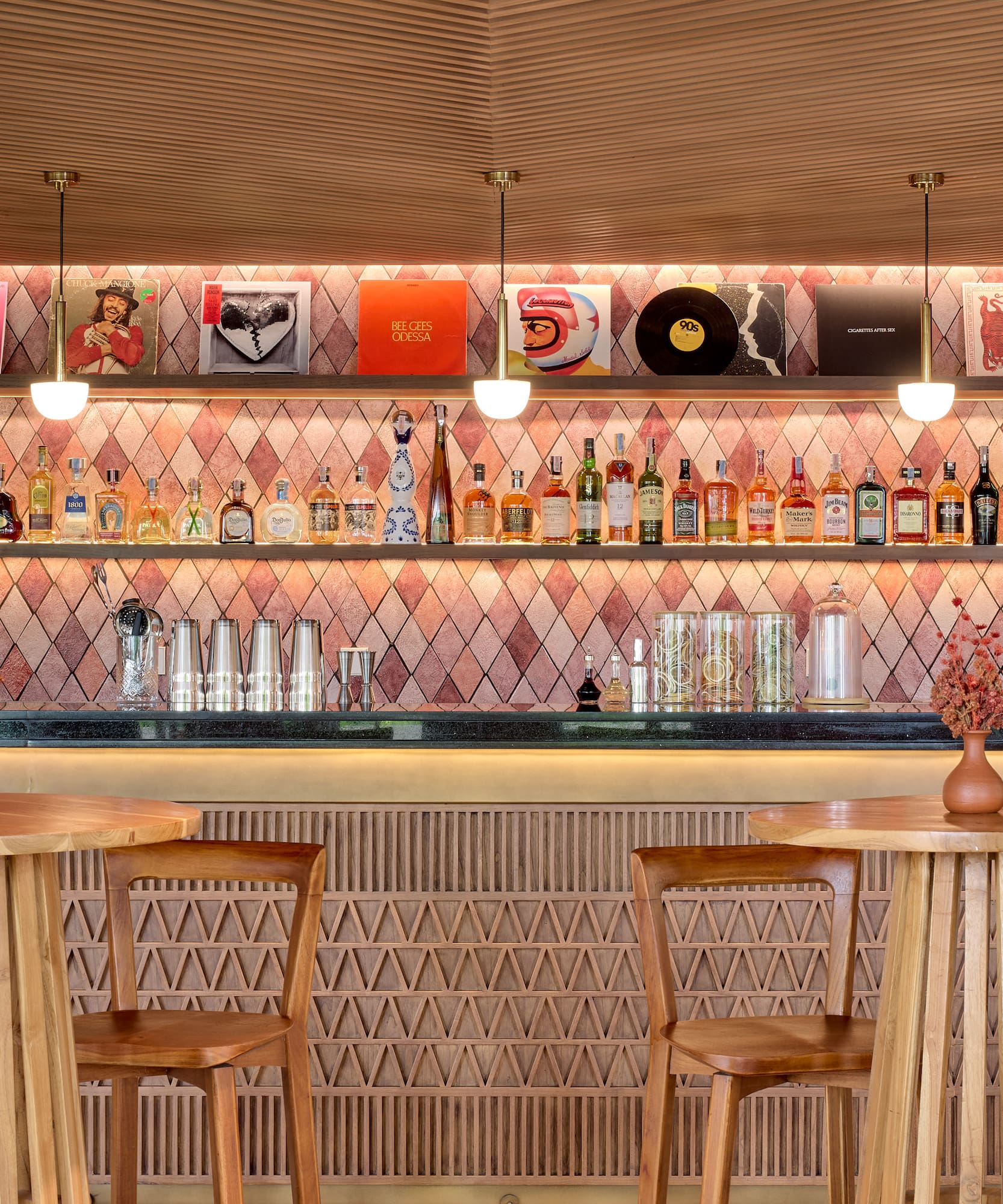 a bar with a counter and chairs