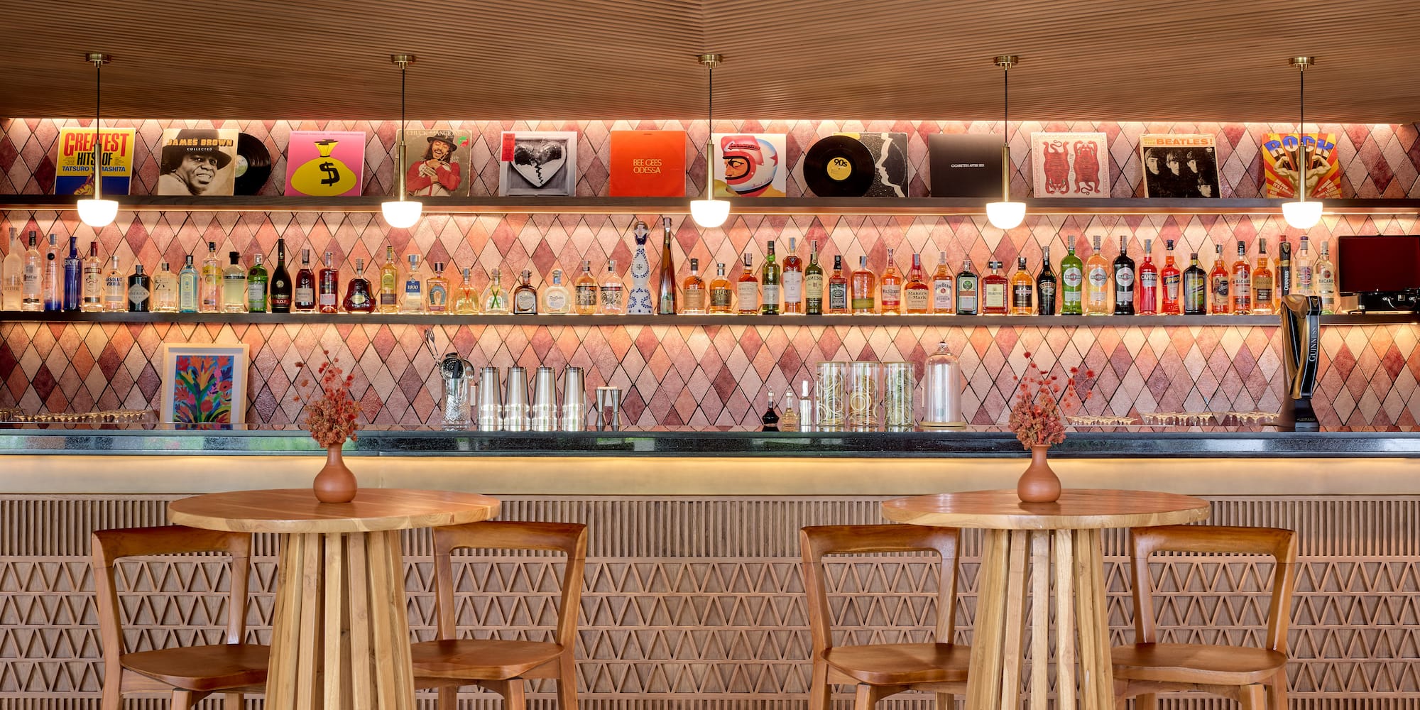 a bar with a counter and chairs