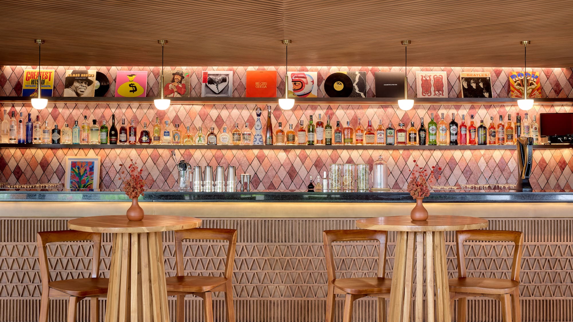 a bar with a counter and chairs