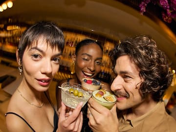 a group of people holding drinks