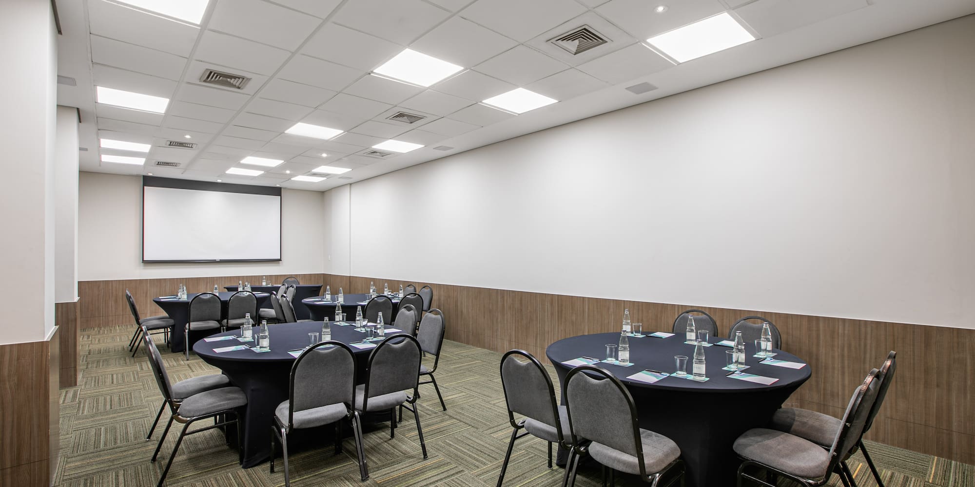 a room with a large table and chairs