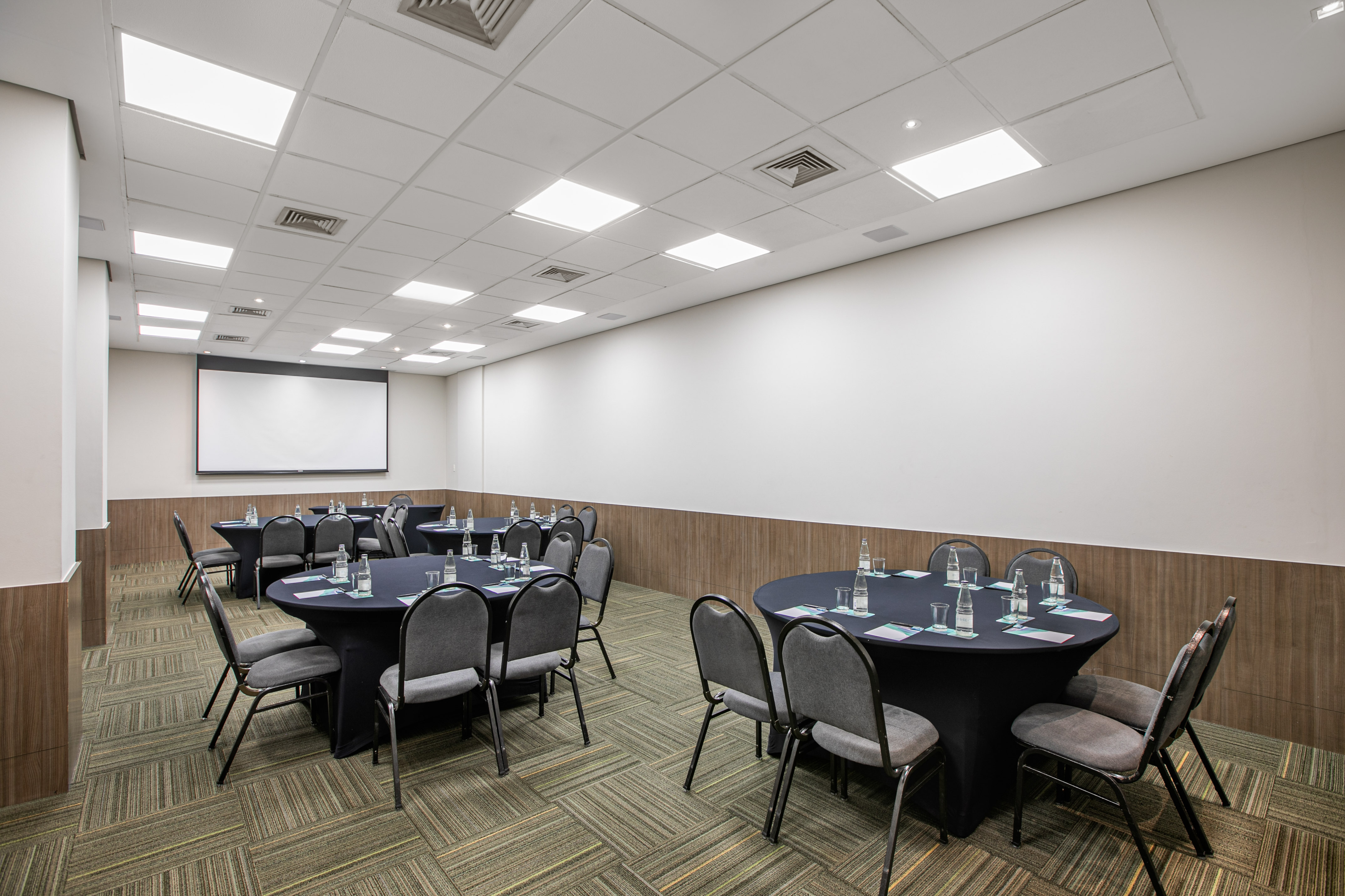 a room with a large table and chairs