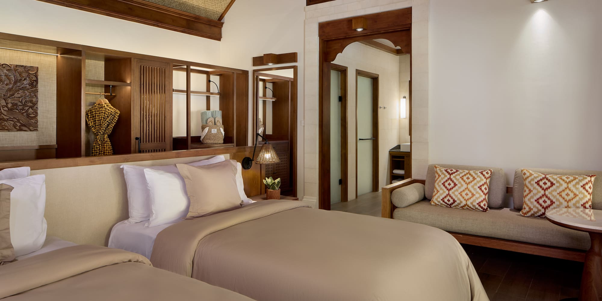 a room with two beds and a couch