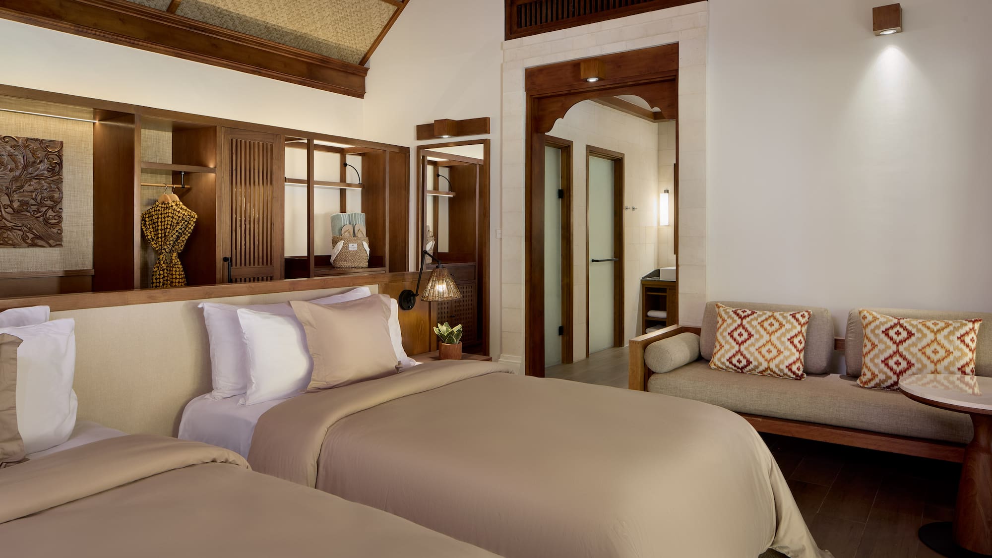 a room with two beds and a couch