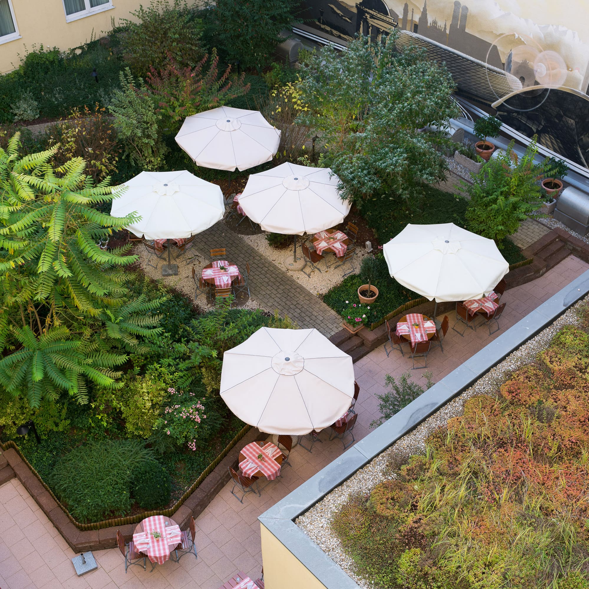 a patio area with tables and umbrellas