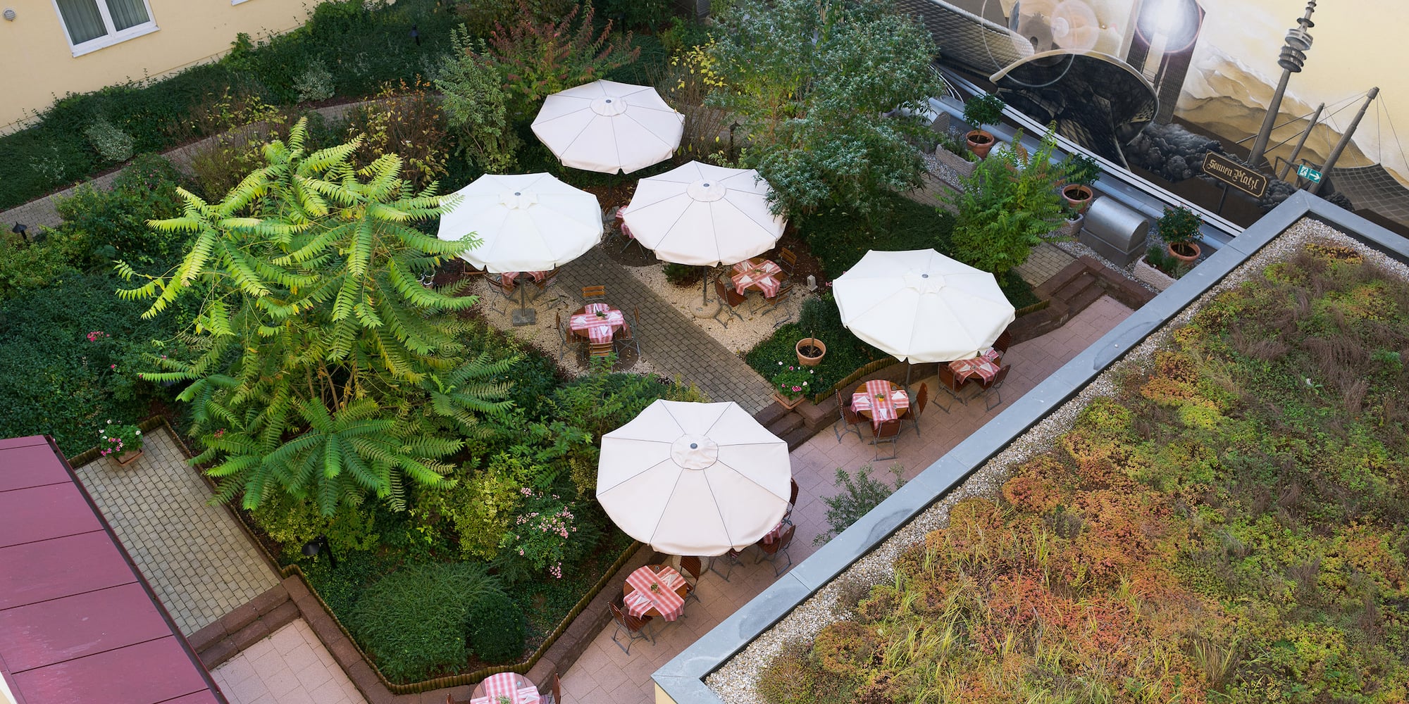 a patio area with tables and umbrellas