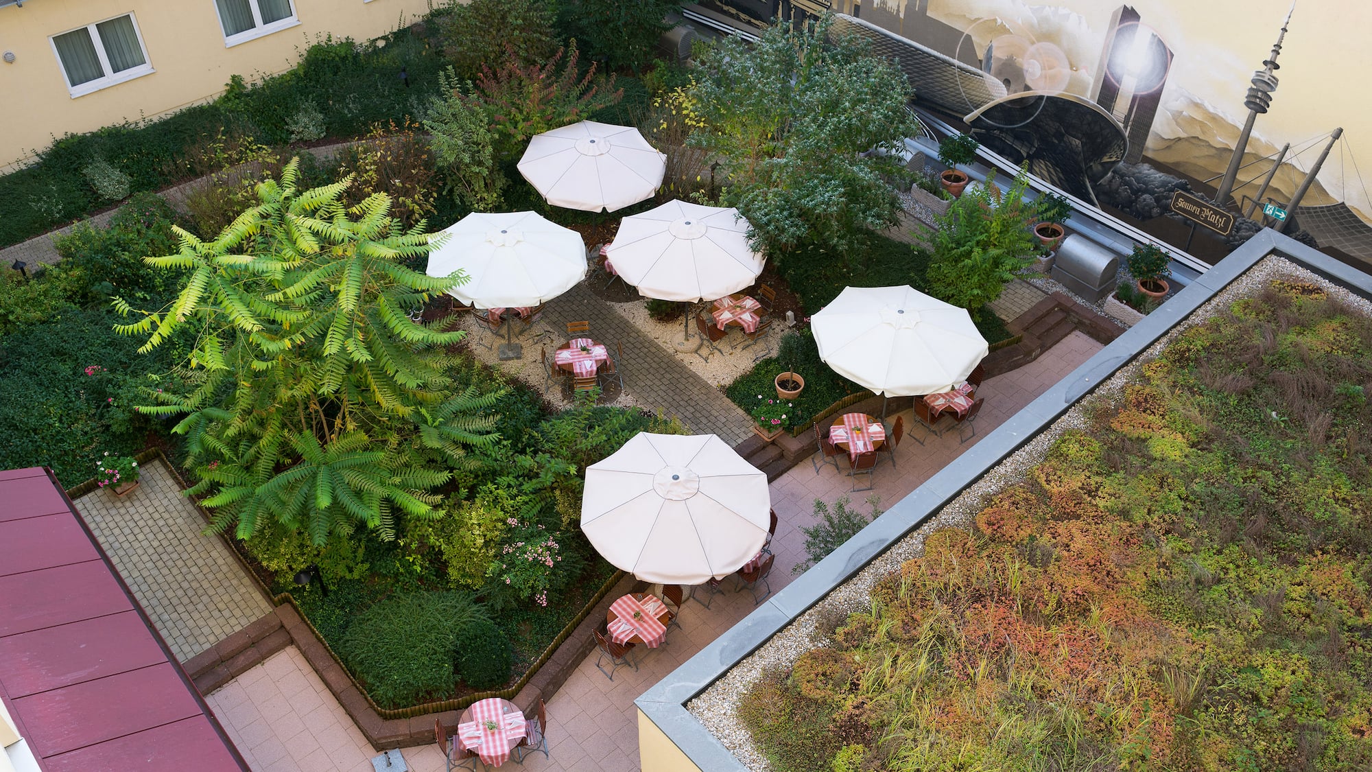 a patio area with tables and umbrellas