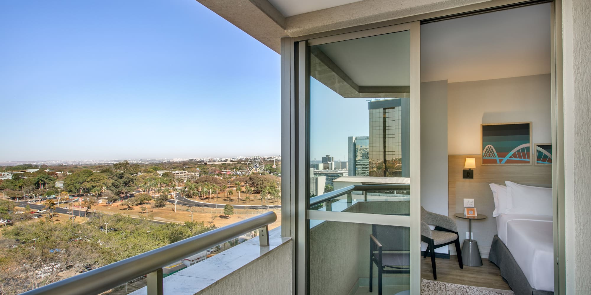 a balcony with a view of a city