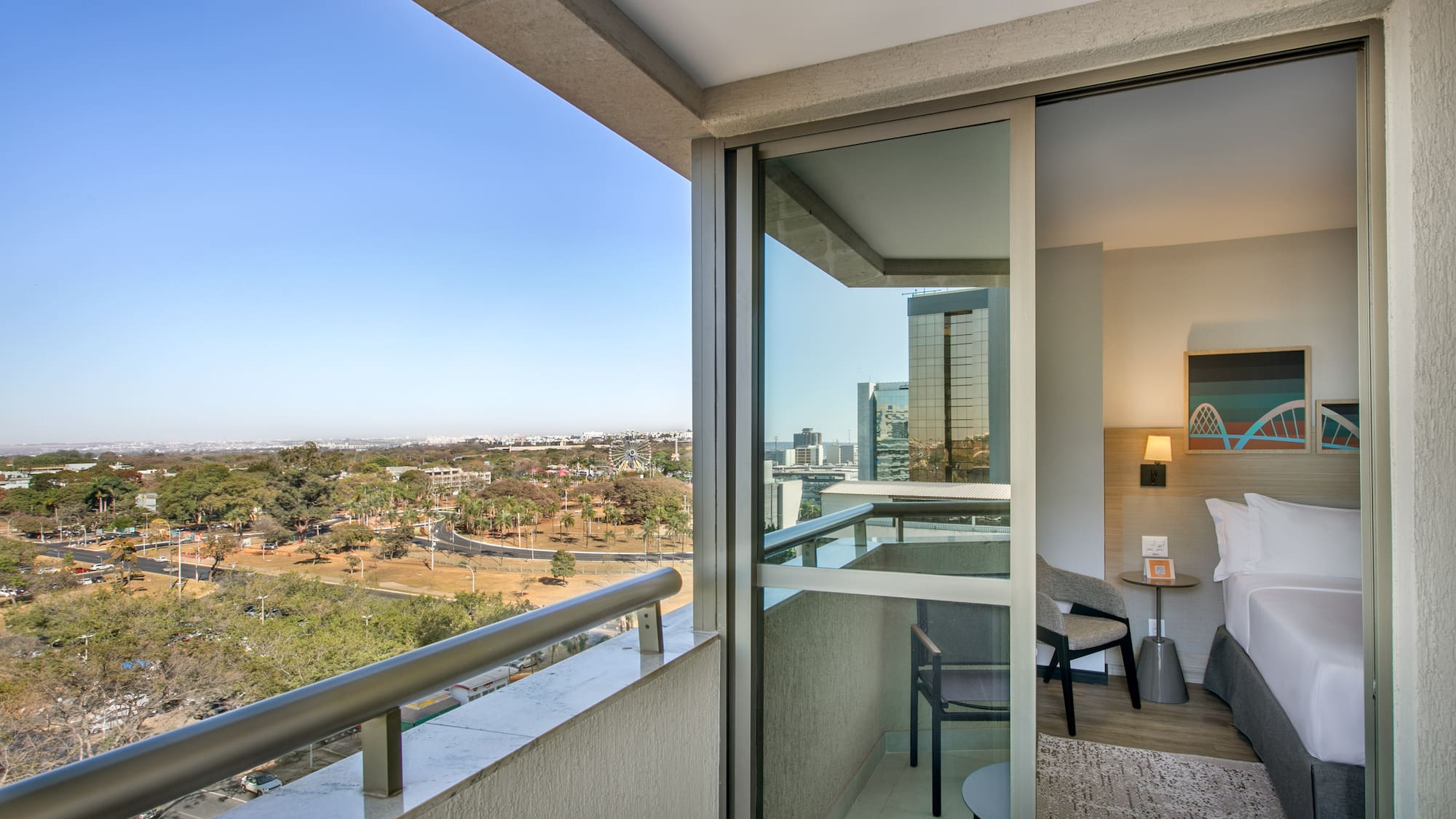 a balcony with a view of a city