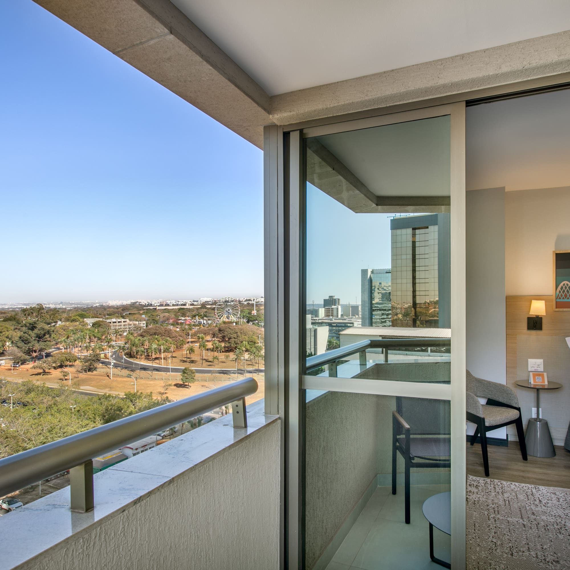a balcony with a view of a city