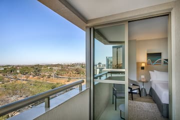 a balcony with a view of a city