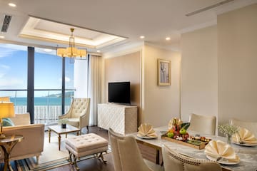 a living room with a television and a table