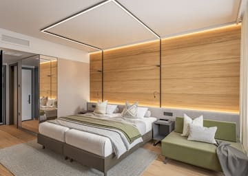 a bedroom with a mirror and a bed