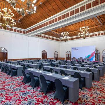 a large room with tables and chairs