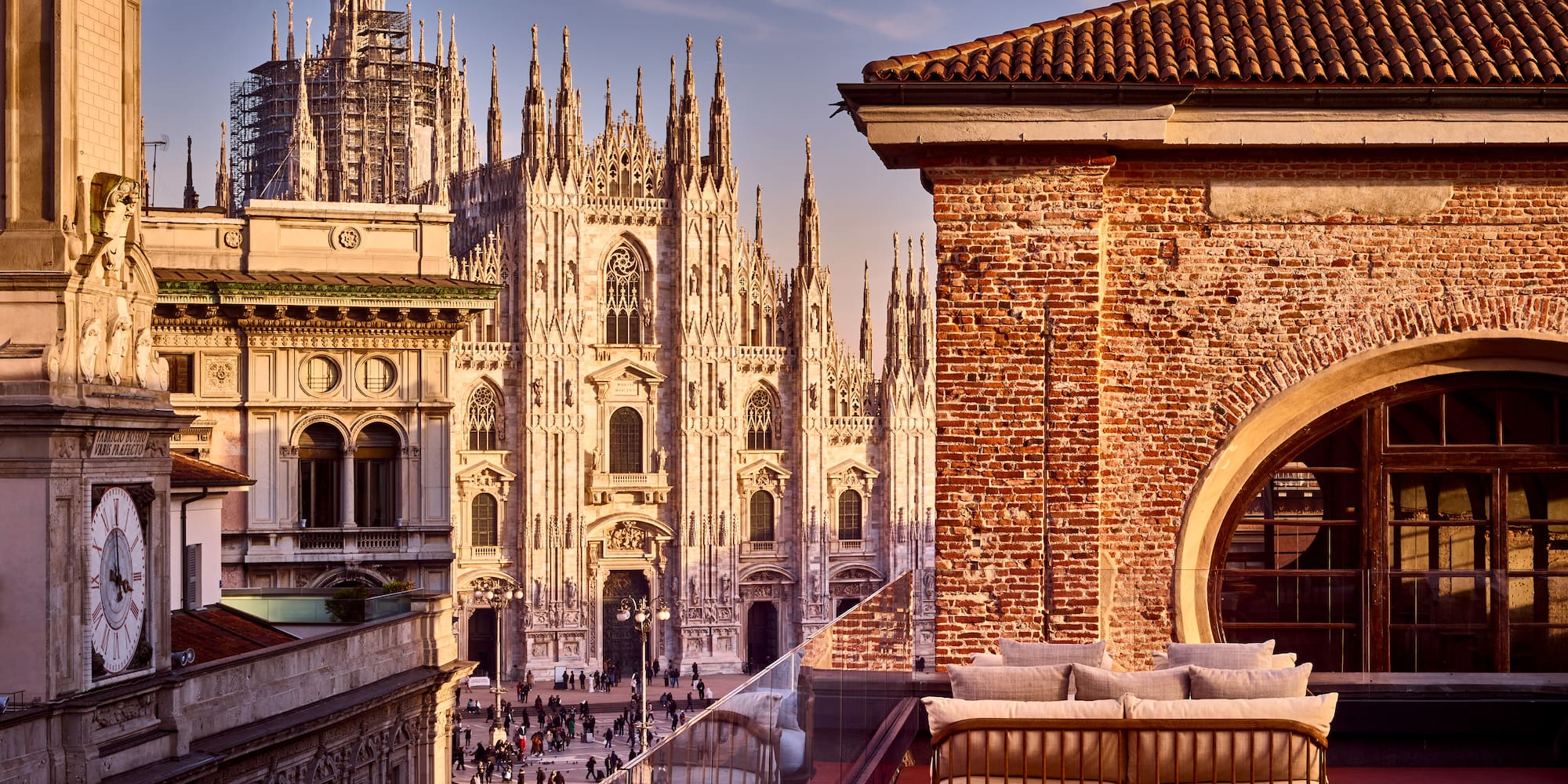 a rooftop view of a building with a large building in the background