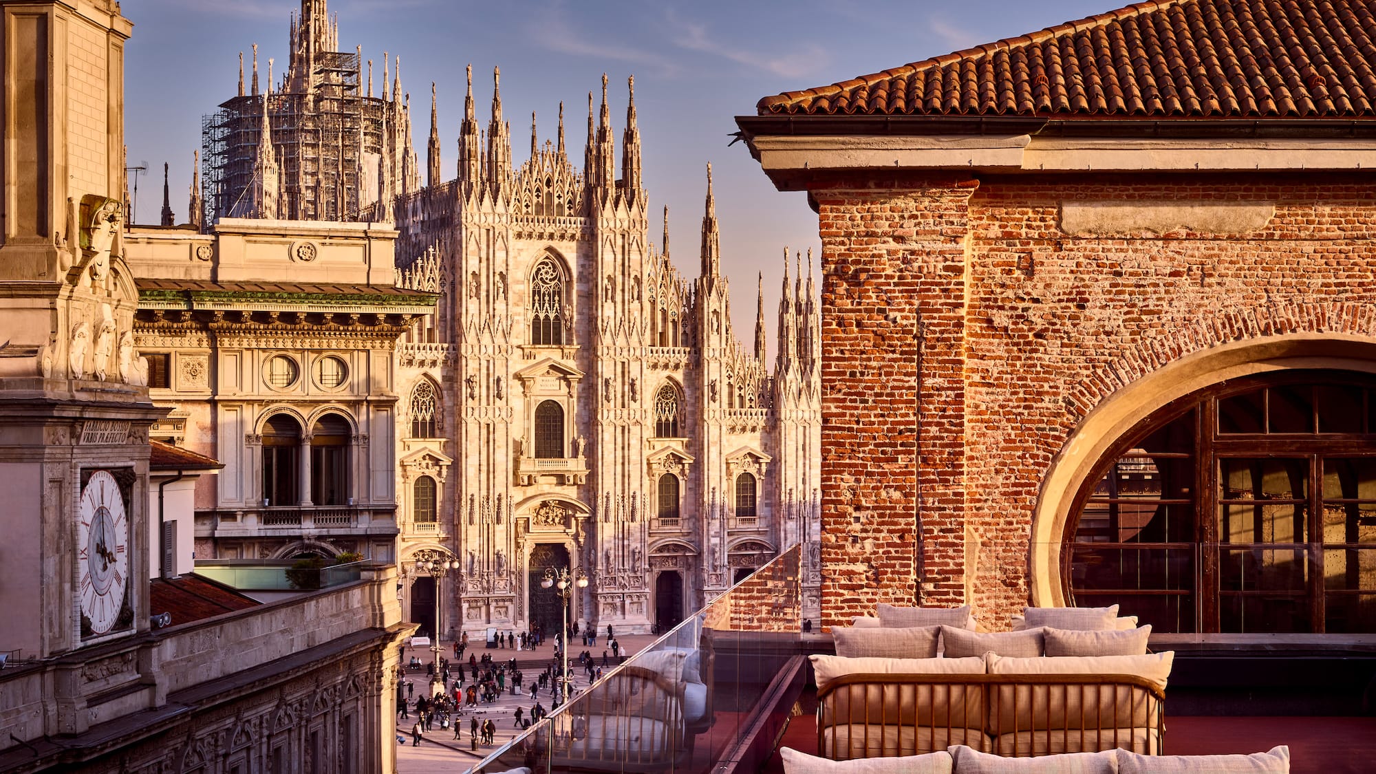 a rooftop view of a building with a large building in the background