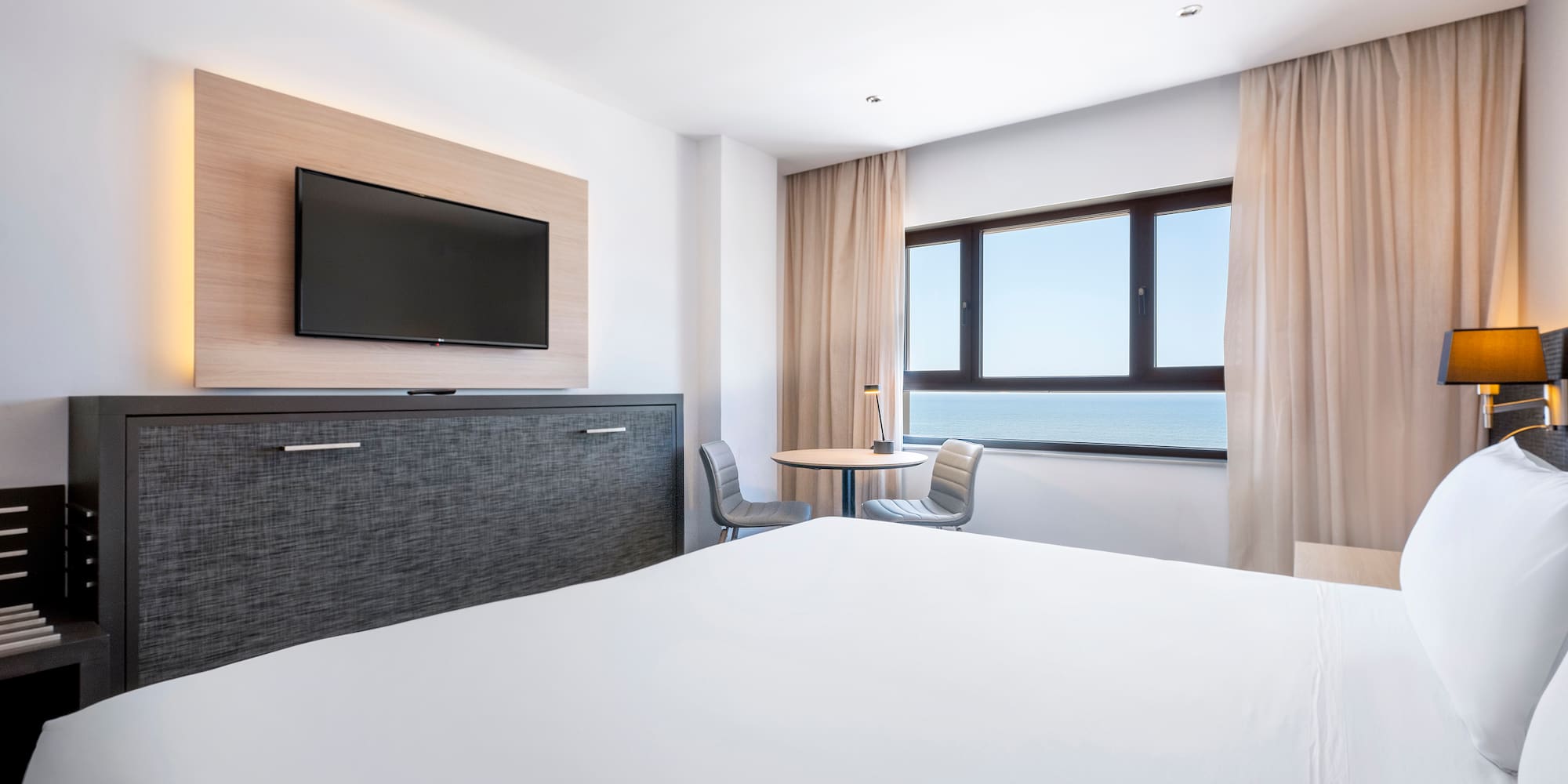 a room with a television and a bed