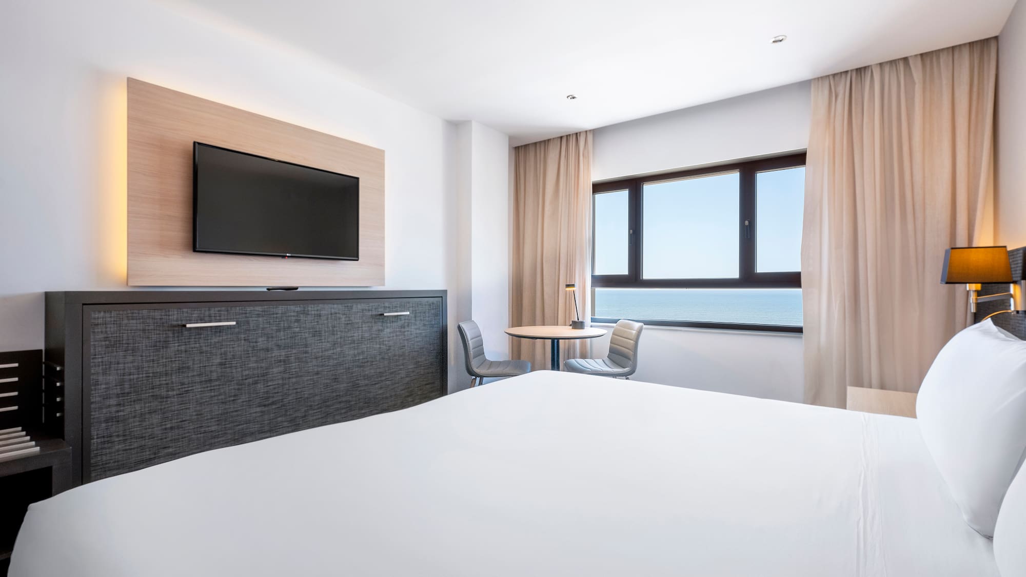 a room with a television and a bed