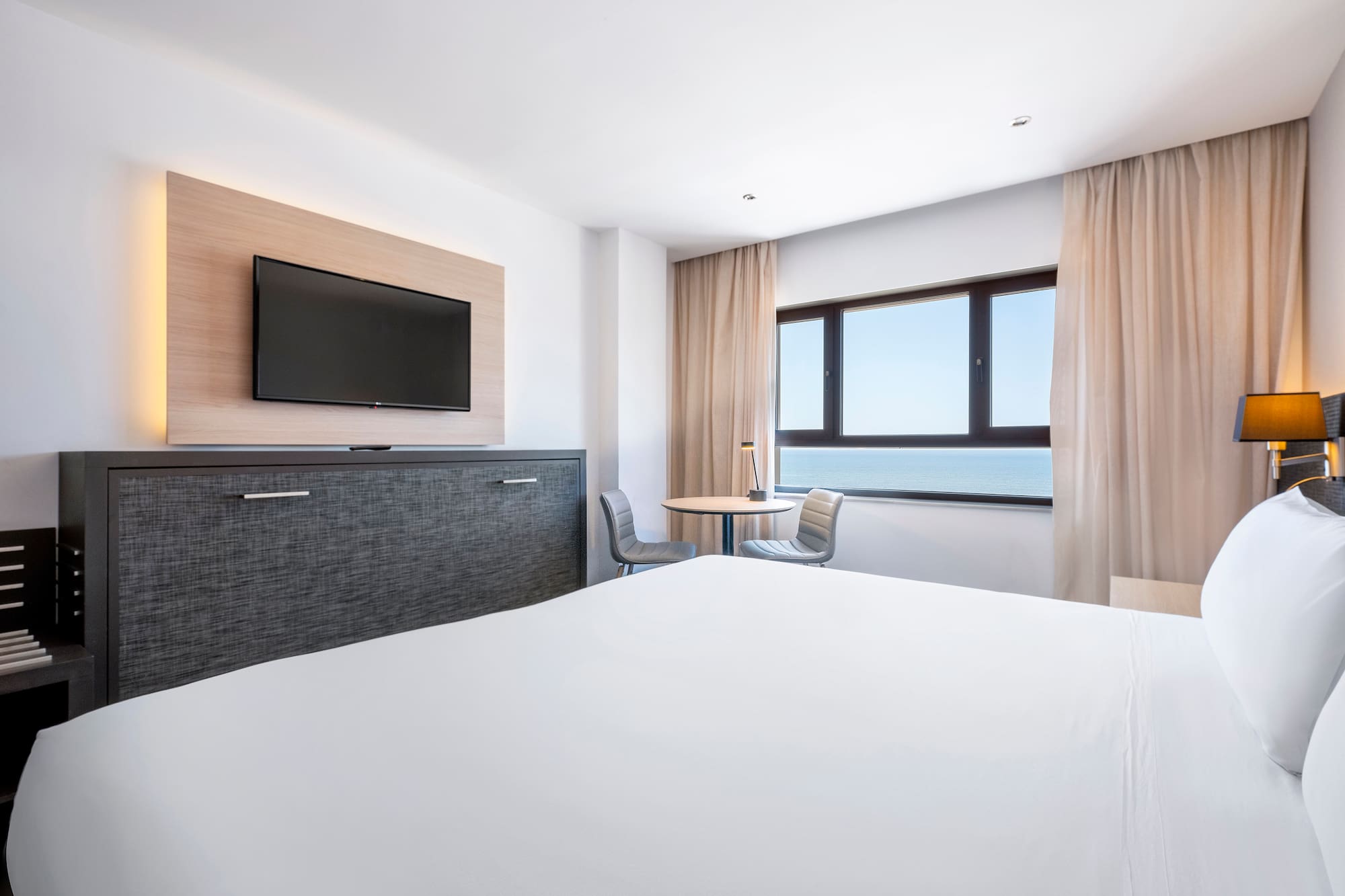 a room with a television and a bed