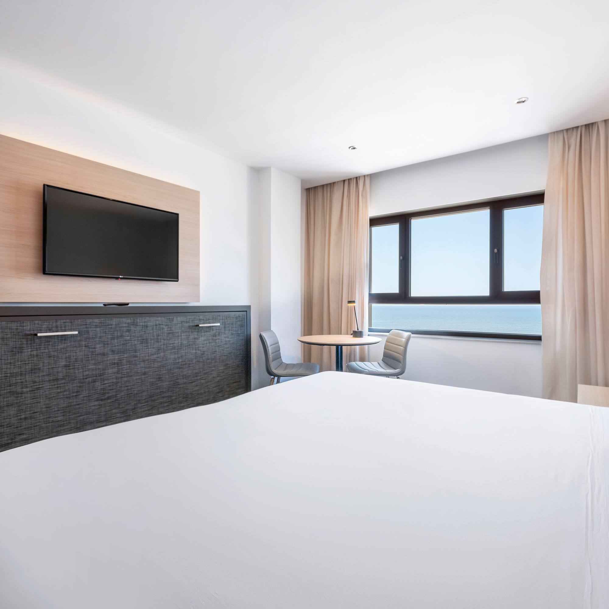 a room with a television and a bed