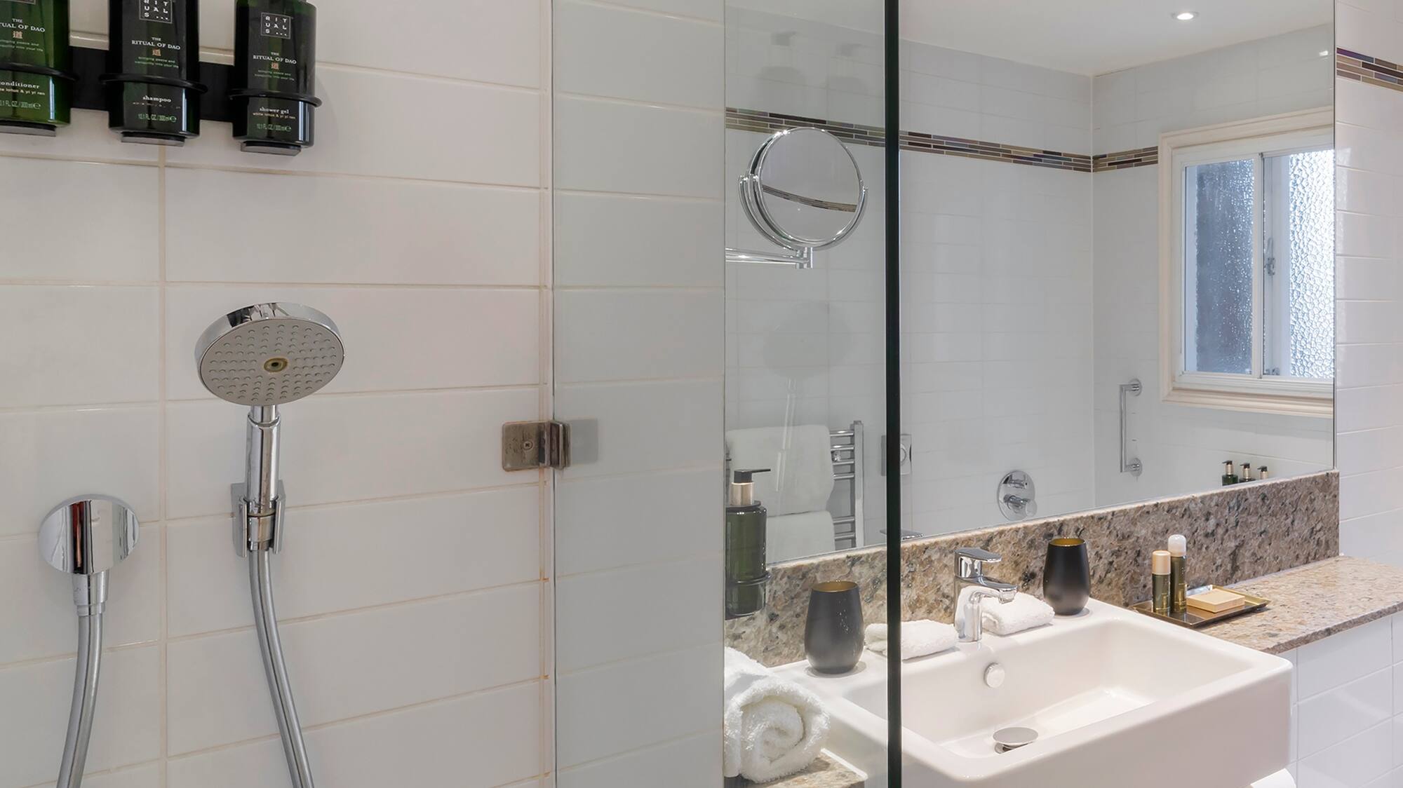 a bathroom with a shower and sink