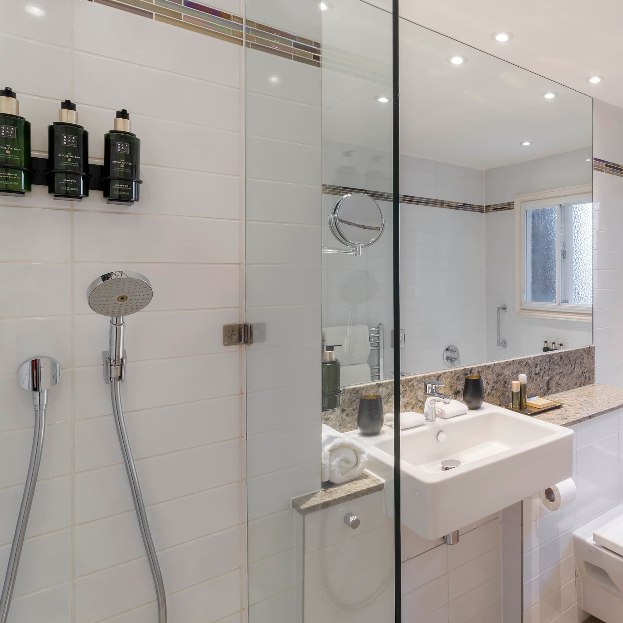 a bathroom with a shower and sink