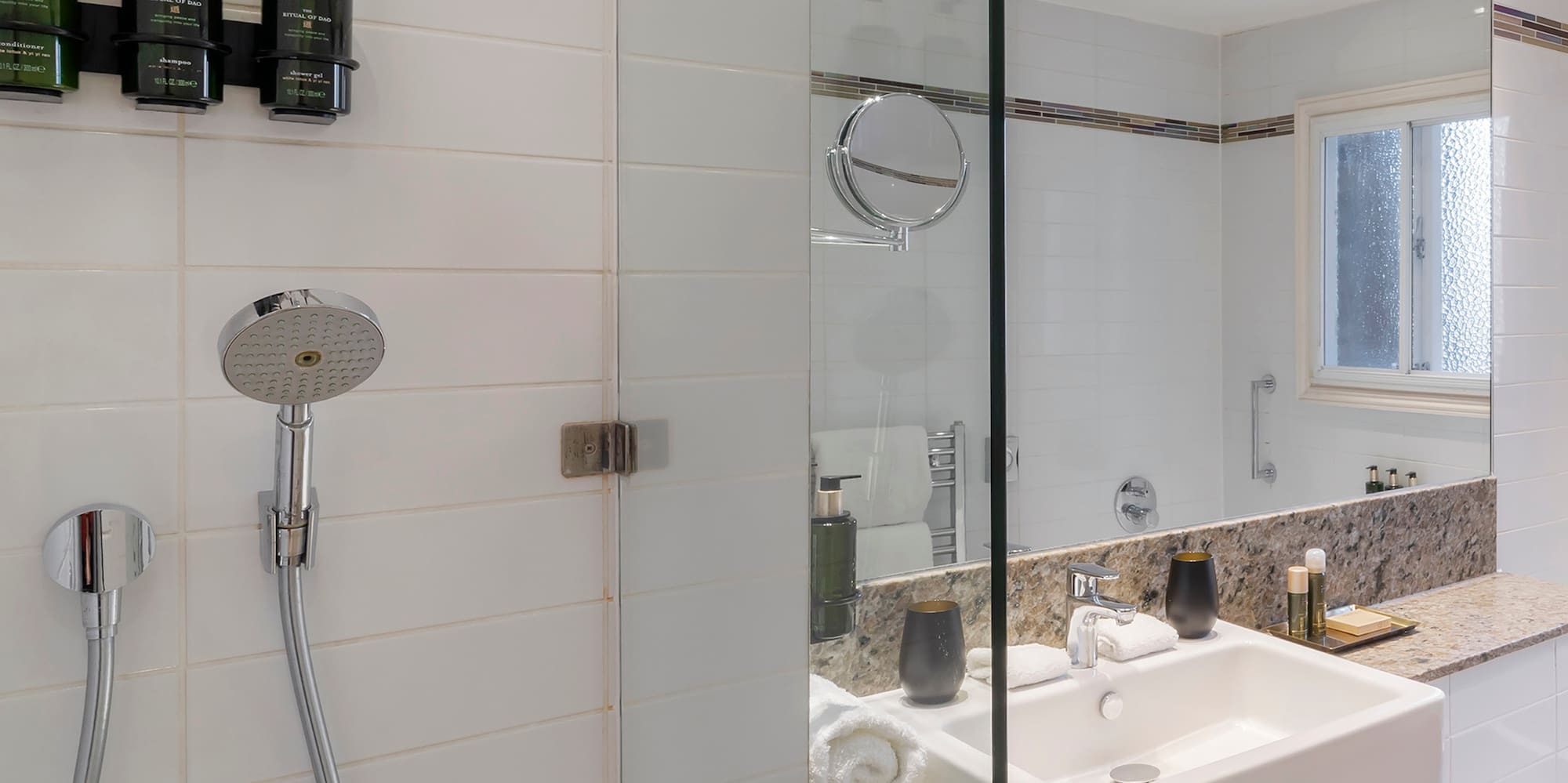 a bathroom with a shower and sink