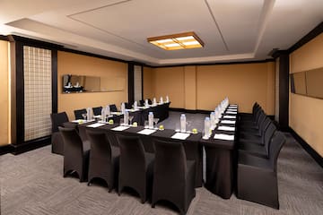 a room with black chairs and tables