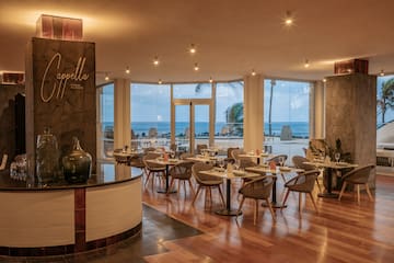 a restaurant with tables and chairs