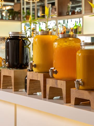 a row of jars with liquid in them