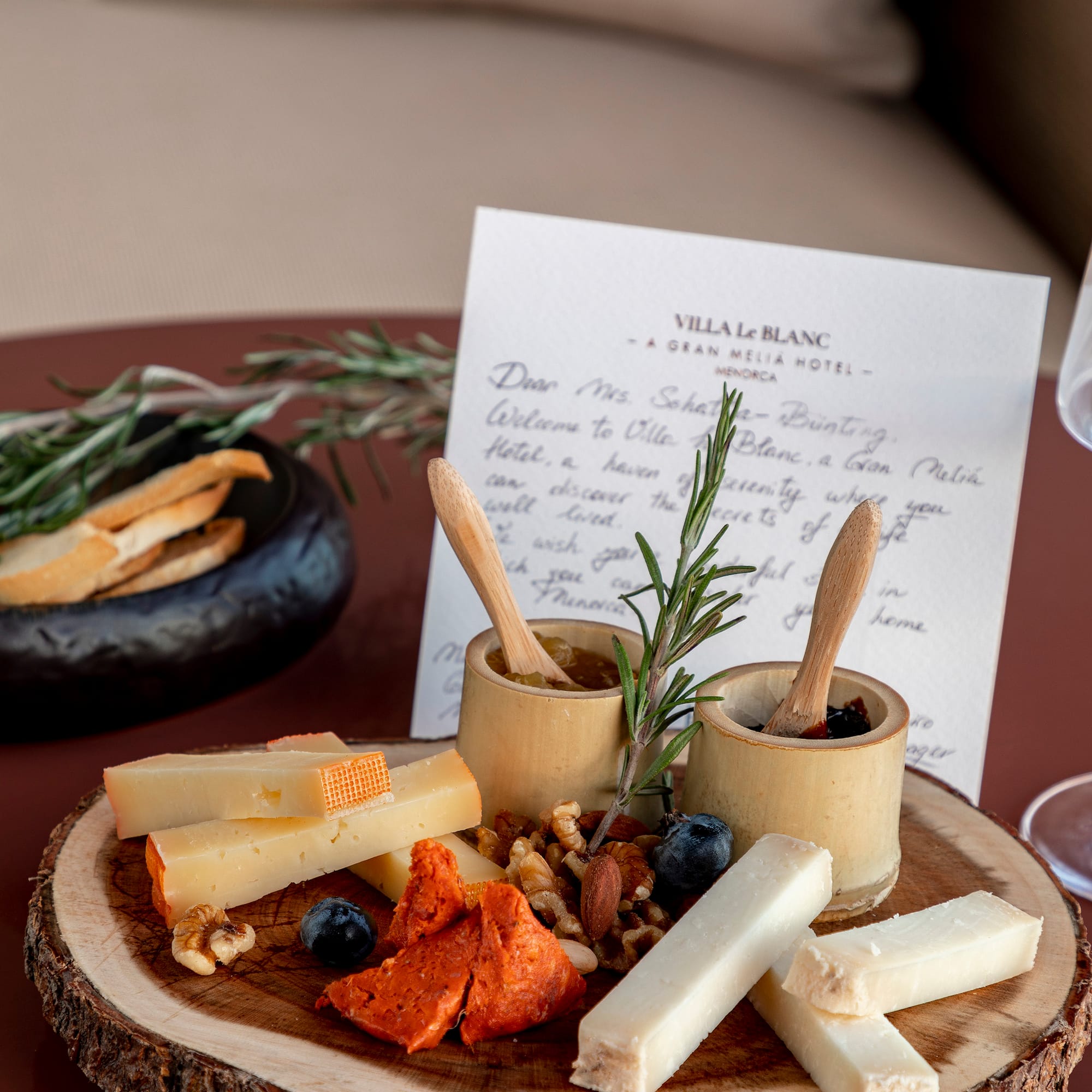 a plate of cheese and nuts