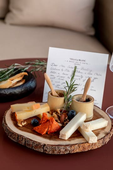 a plate of cheese and nuts