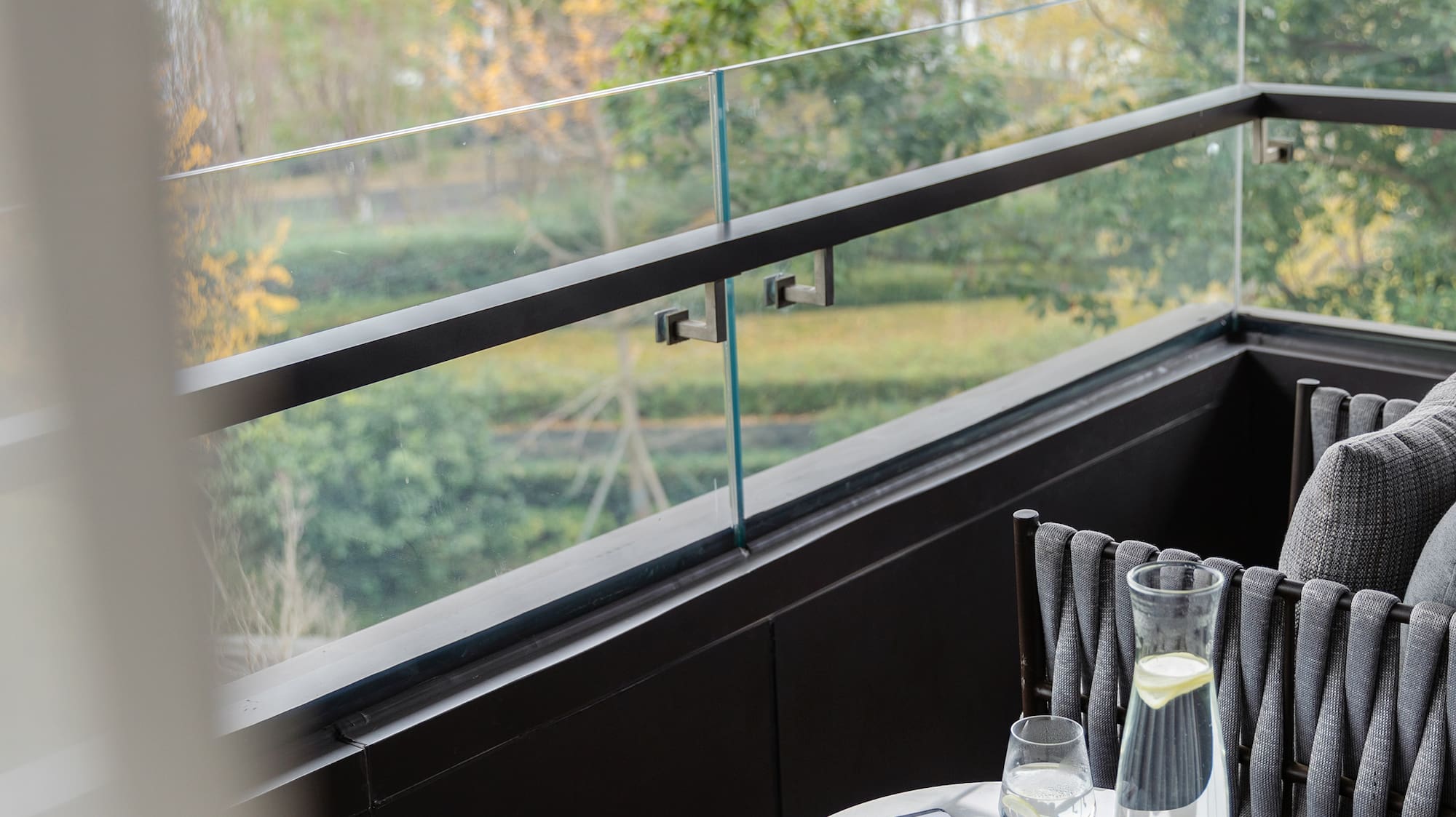 a table with a pen and glasses on it