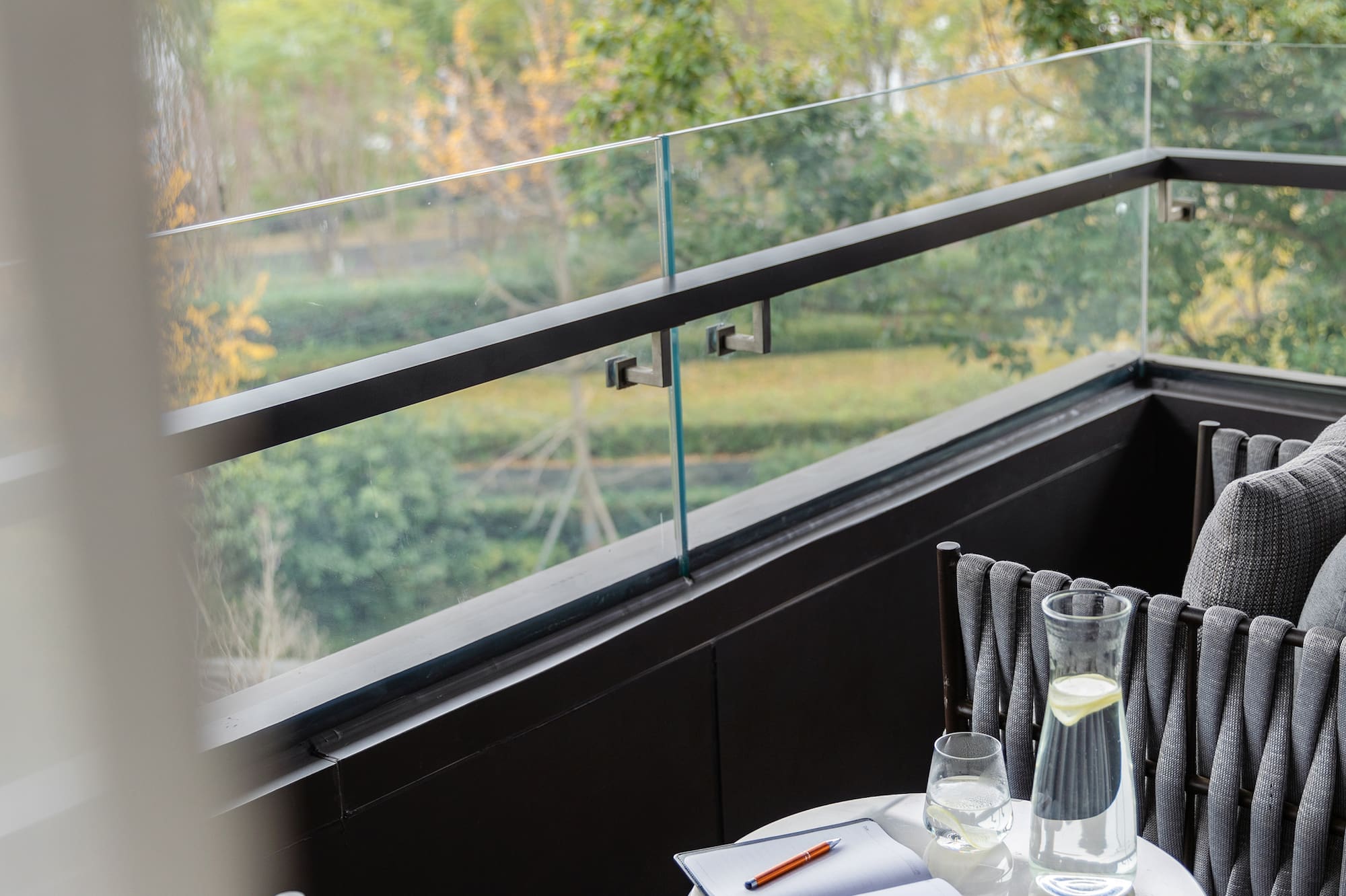 a table with a pen and glasses on it