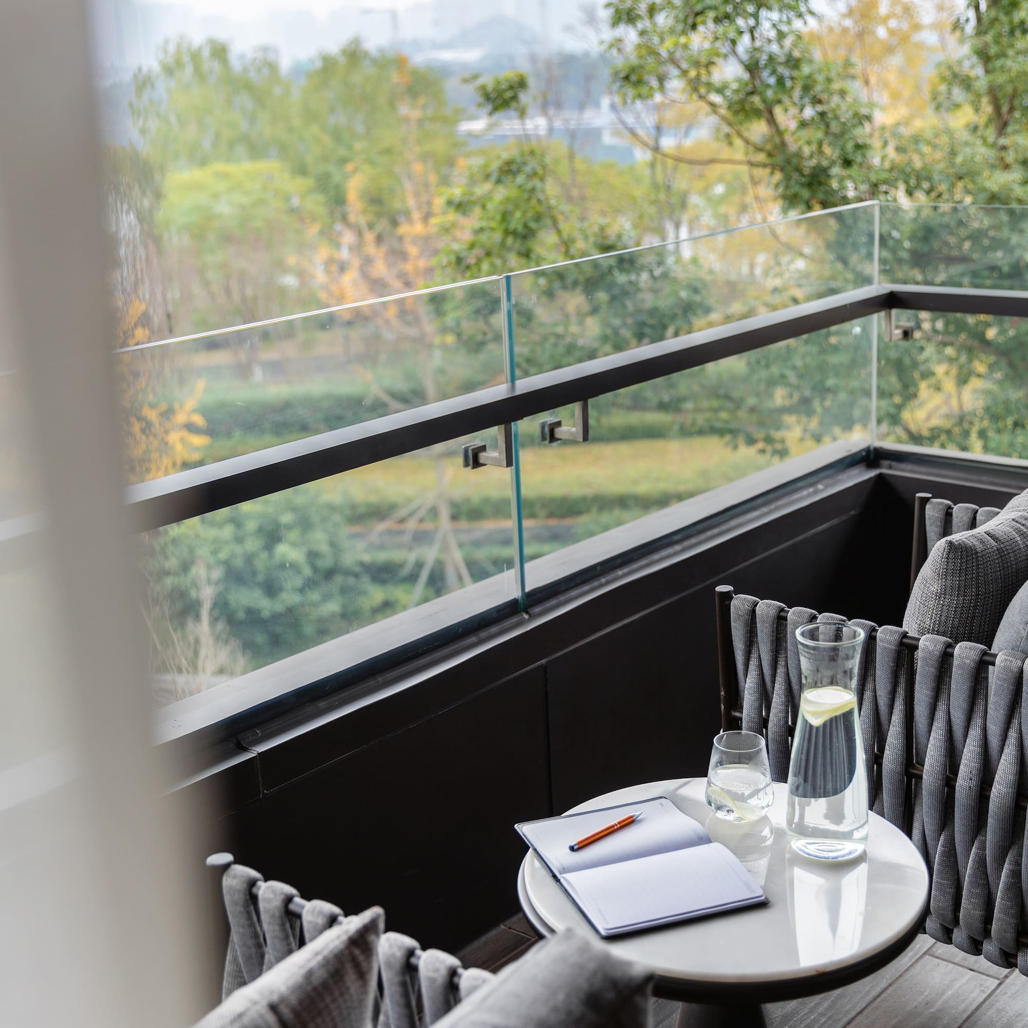 a table with a pen and glasses on it