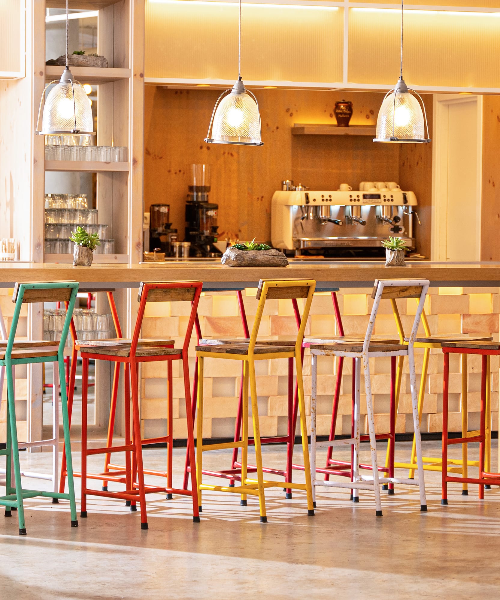 a group of colorful stools in a room