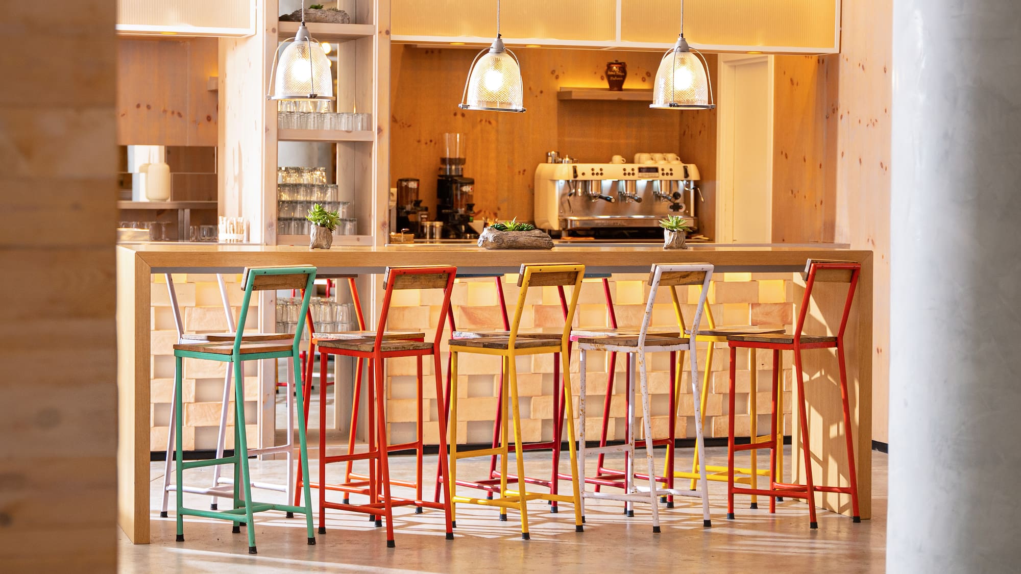 a group of colorful stools in a room