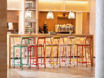 a group of colorful stools in a room