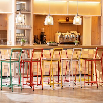 a group of colorful stools in a room