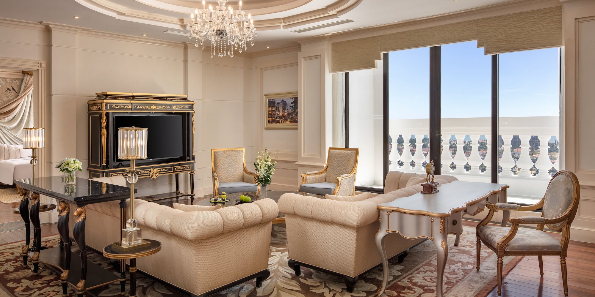 a room with a chandelier and couches