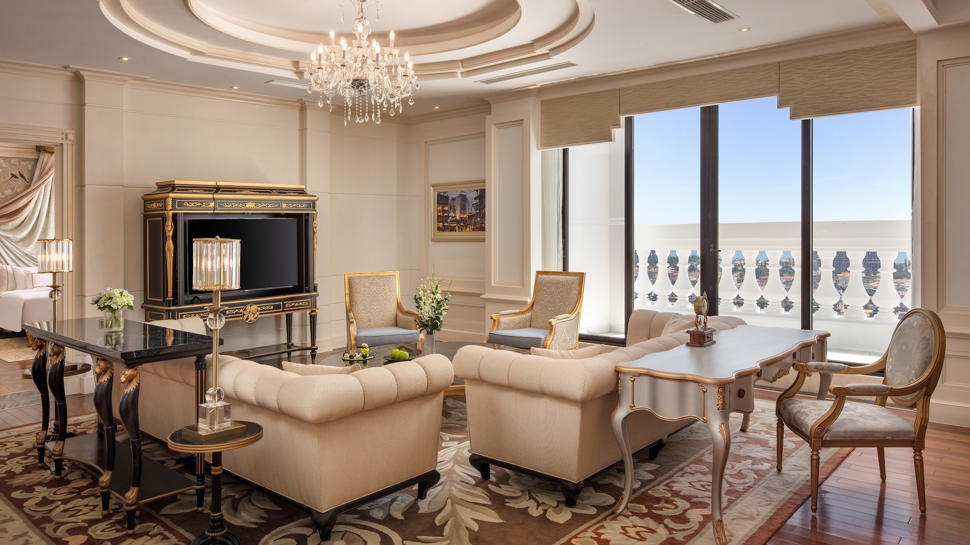 a room with a chandelier and couches