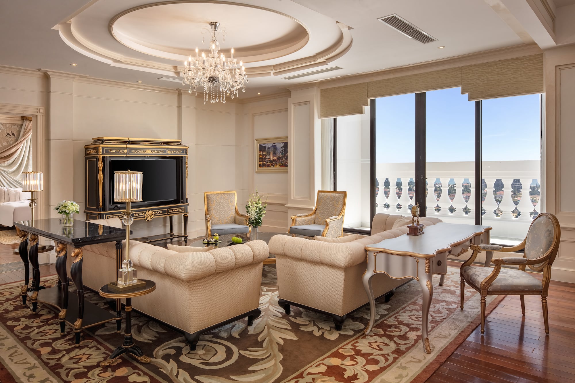 a room with a chandelier and couches