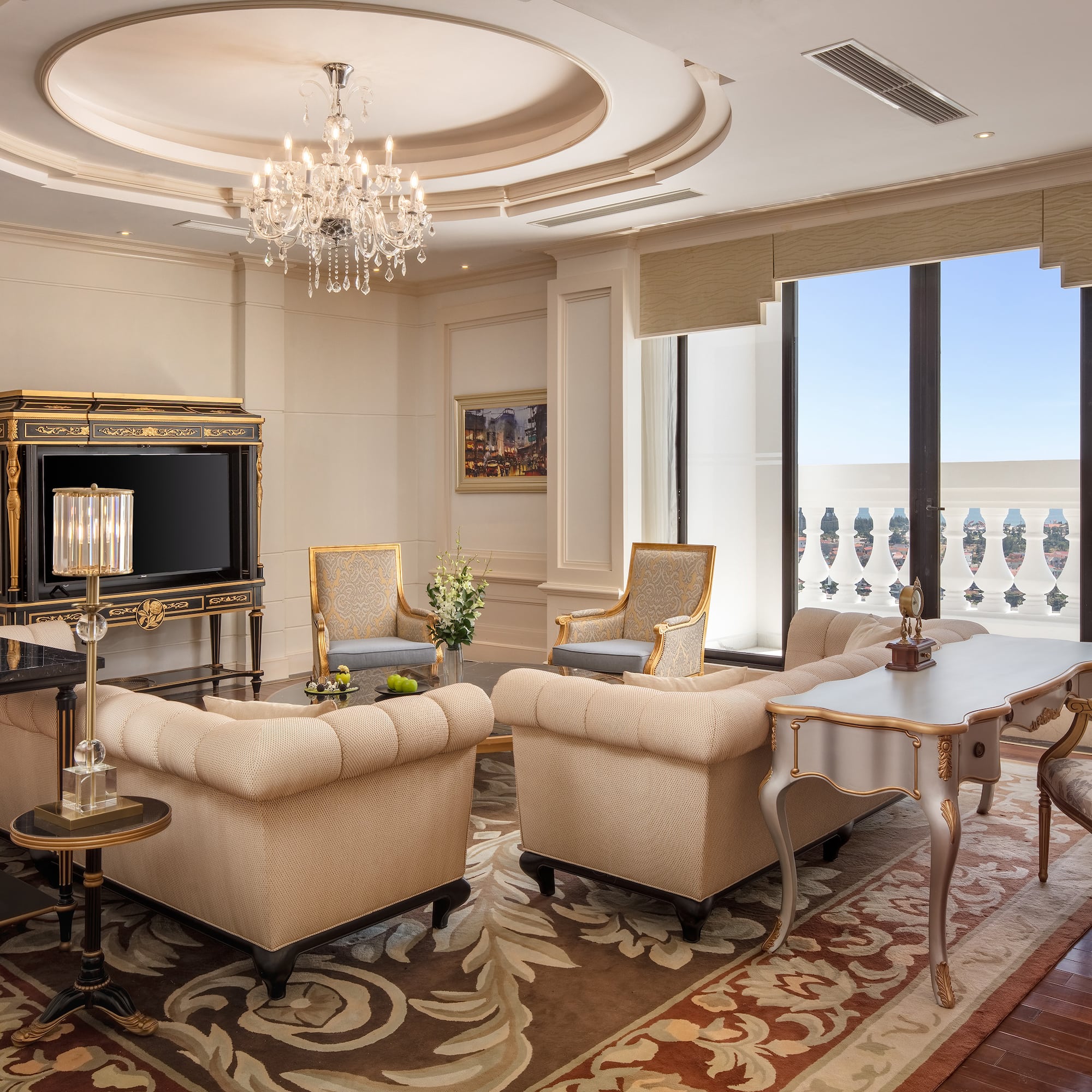 a room with a chandelier and couches