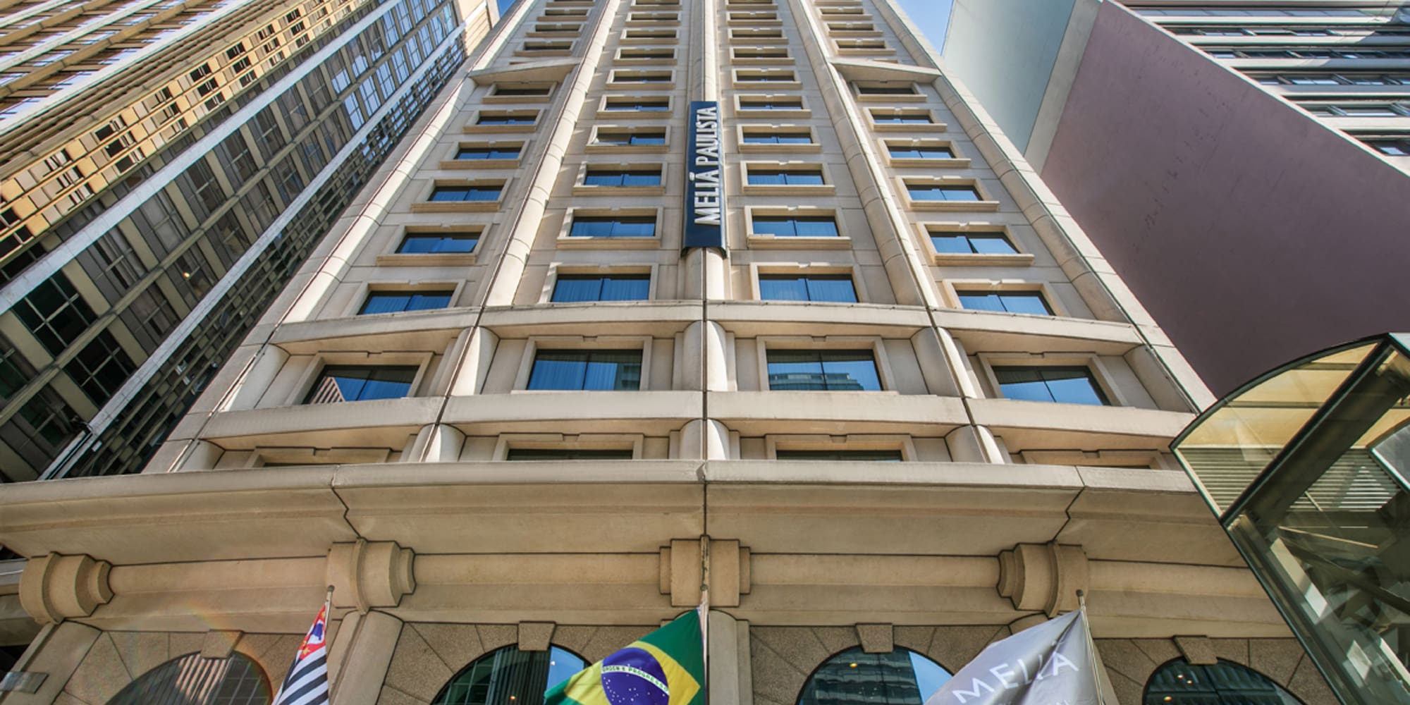 a tall building with flags