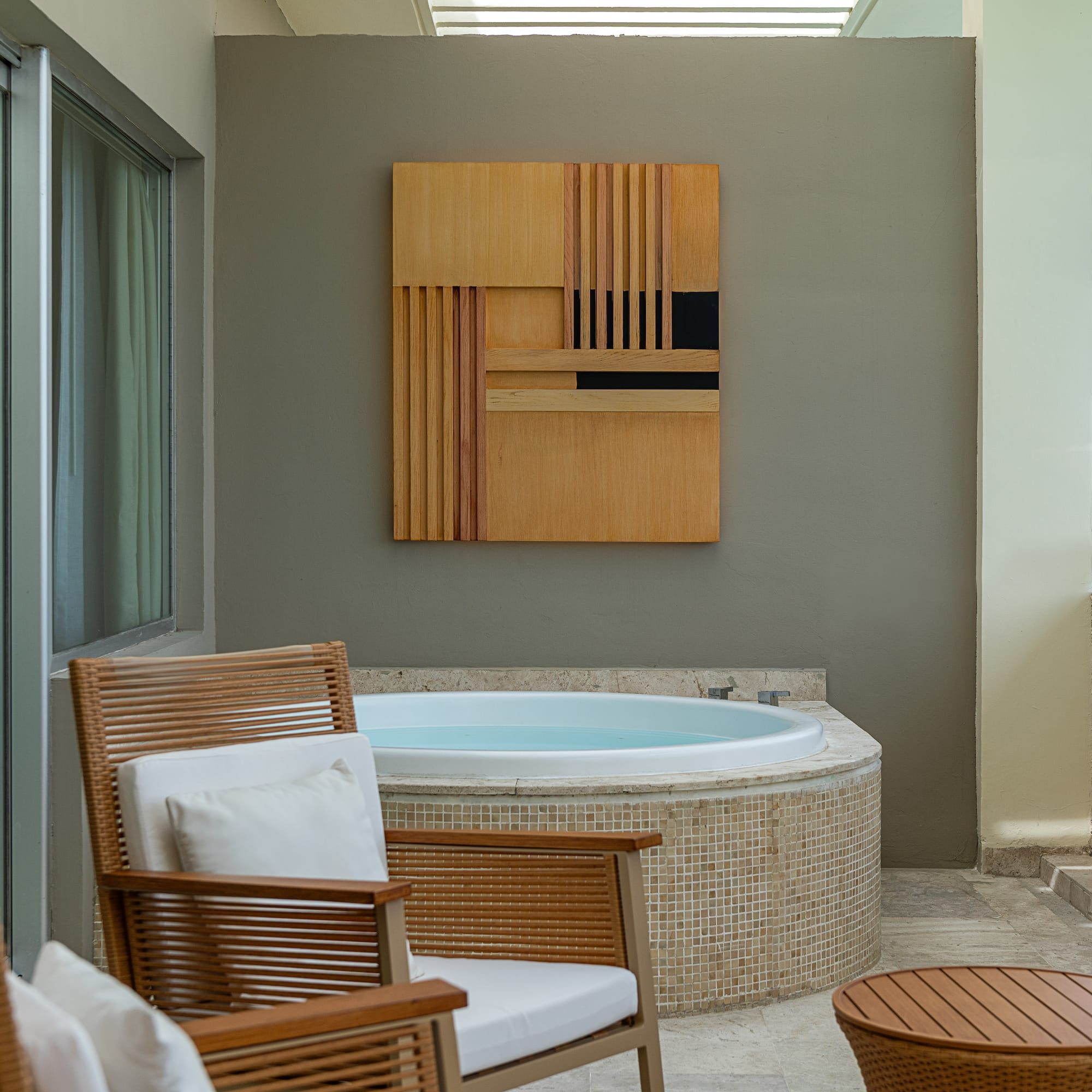 a room with a hot tub and a table