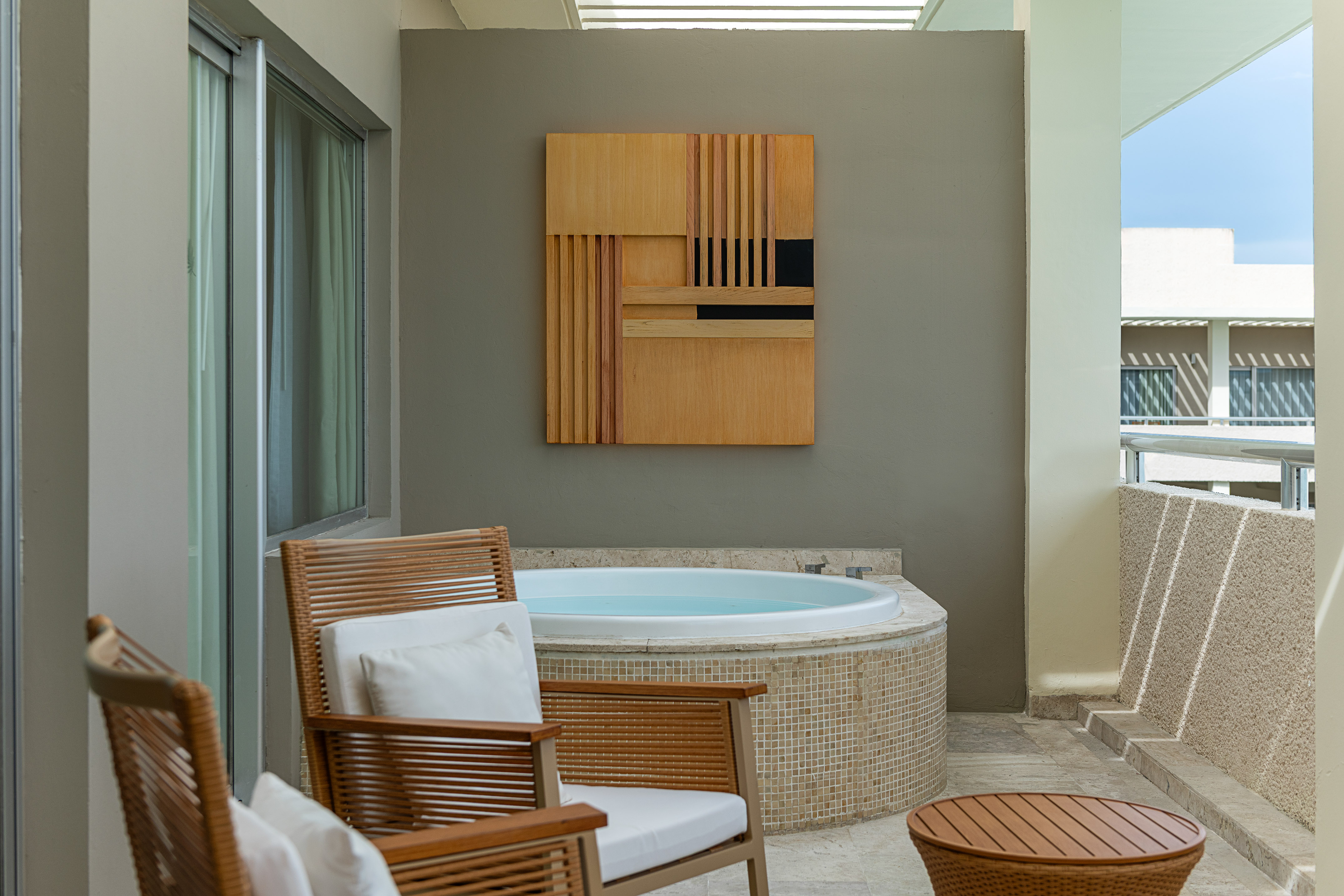 a room with a hot tub and a table